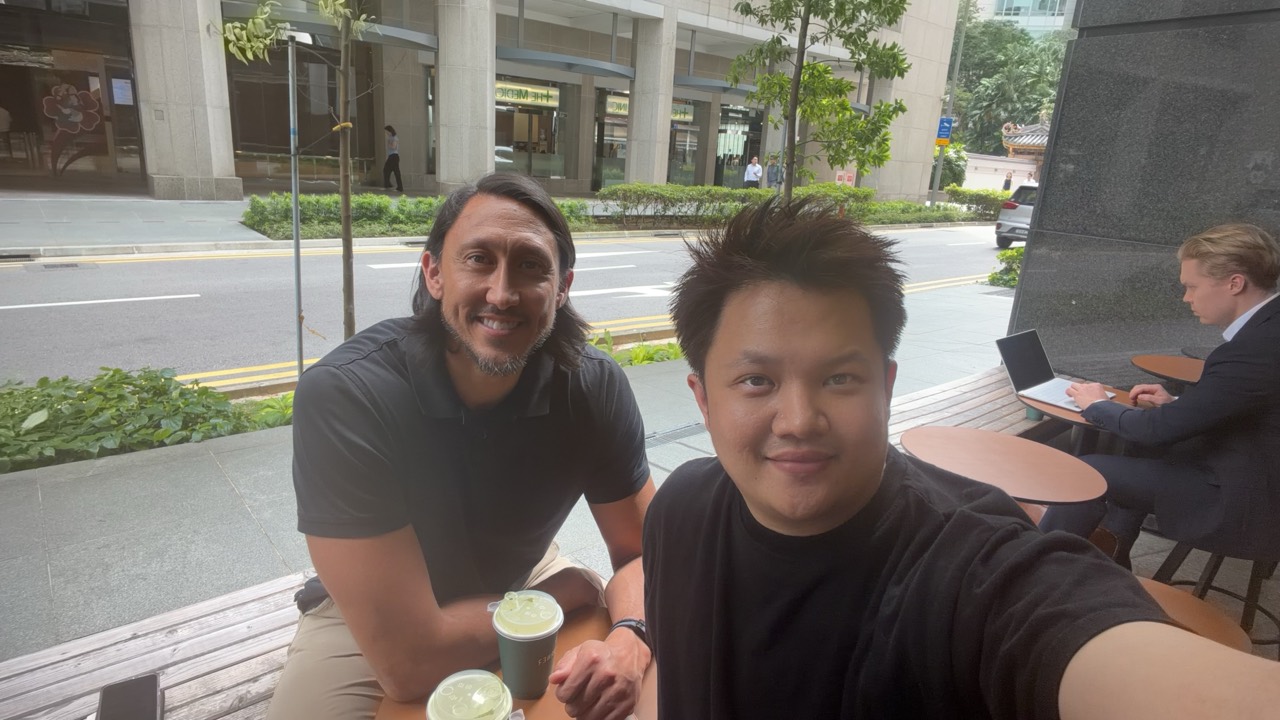 Lucas Loo meeting an industry contact outdoors