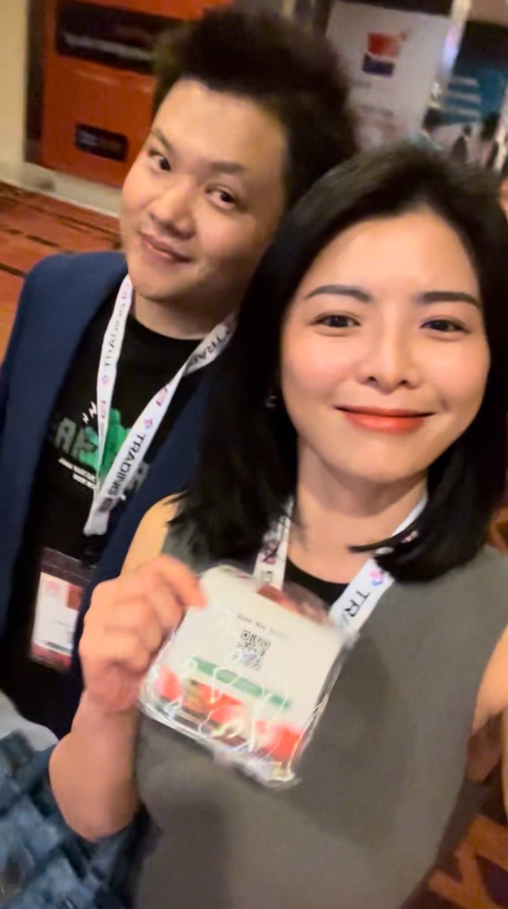 Lucas Loo with an industry contact at a trading event